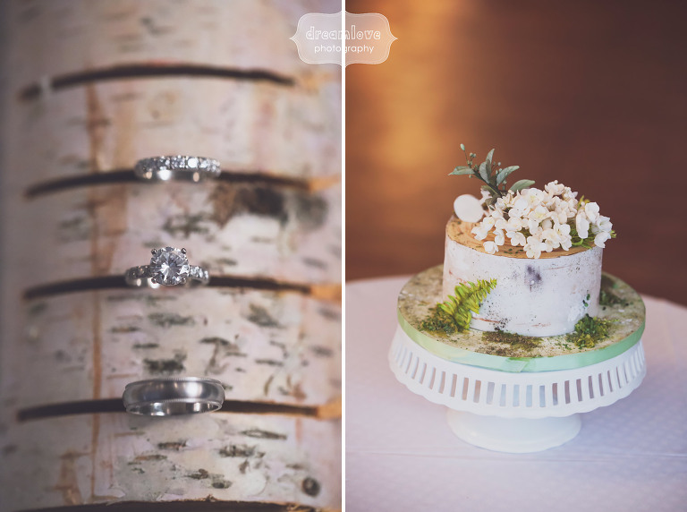 Vintage wedding details with porcelain cake stand and birch log with wedding rings at Topnotch in Stowe, VT.
