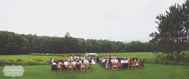 Landscape artsy photo of the field ceremony site at a Topnotch Summer wedding in Stowe, VT. 