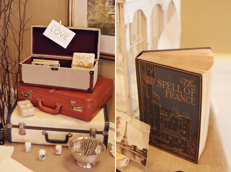 Vintage suitcases and antique books greeted guests at the reception entrance for a Woodstock Inn Winter Wedding. 