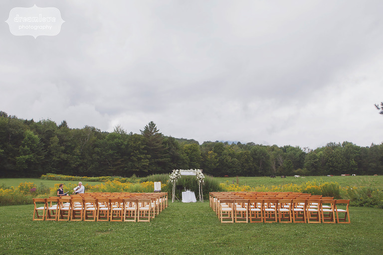View of the outdoor ceremony space at Topnotch Resort in Stowe, VT surrounded by mountains.