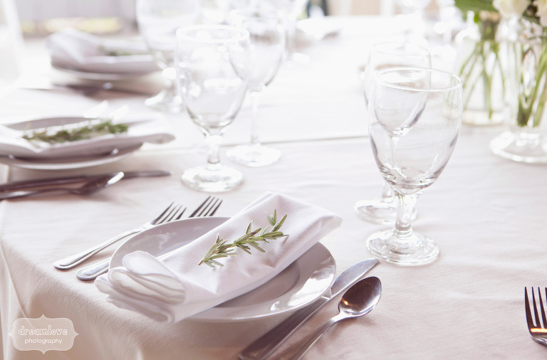 Sprigs of rosemary placed on top of napkins were part of the wedding reception decor. 