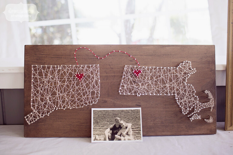 Hipster wedding decor idea of string art with states and hearts of where couple is from at this western MA wedding.