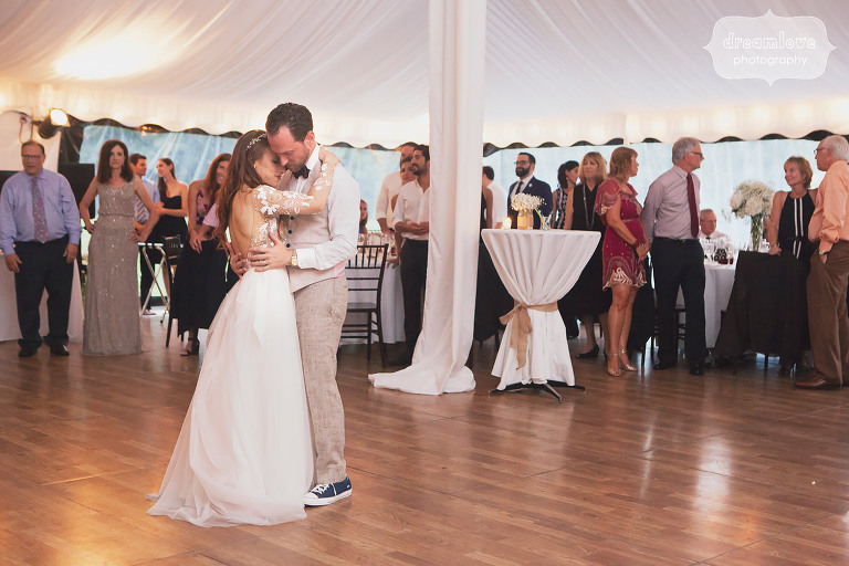 The bride and groom have their first dance in the tent at Topnotch in Stowe, VT.