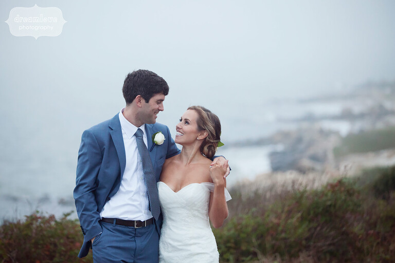 Bride and groom on the shore for their ocean wedding on Cape Cod.