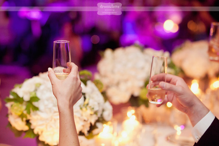Detail of the champagne glasses during wedding toasts. 
