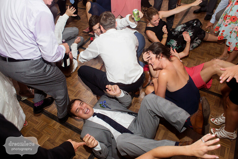 Wedding guests on the ground during the song shout.