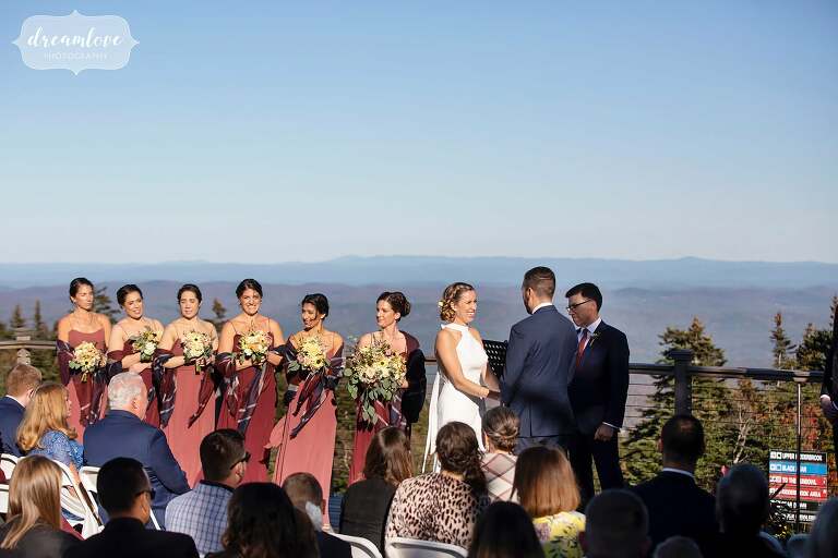 Bride and groom on mountaintop ceremony at Stratton Resort in VT.