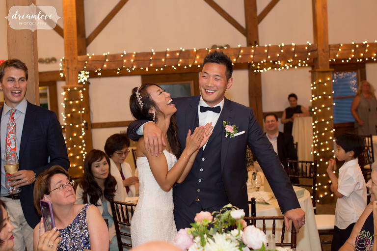 The bride laughs at this Wolfeboro NH wedding reception at the Inn on Main.
