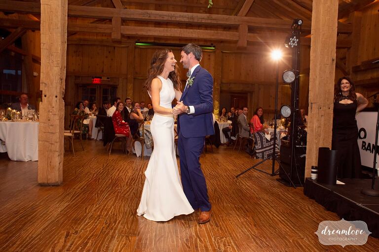 Bride and groom have first dance inside of the lodge at Devil's Thumb.