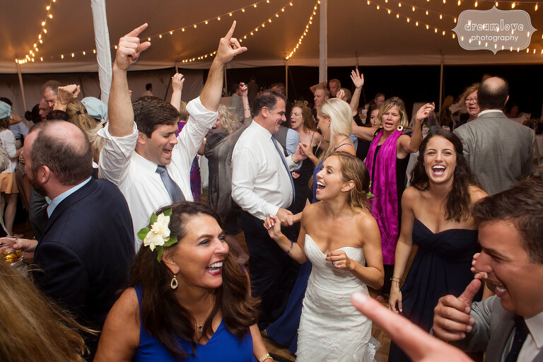 Documentary wedding dance photos of bride and groom at Cape Cod tented reception.