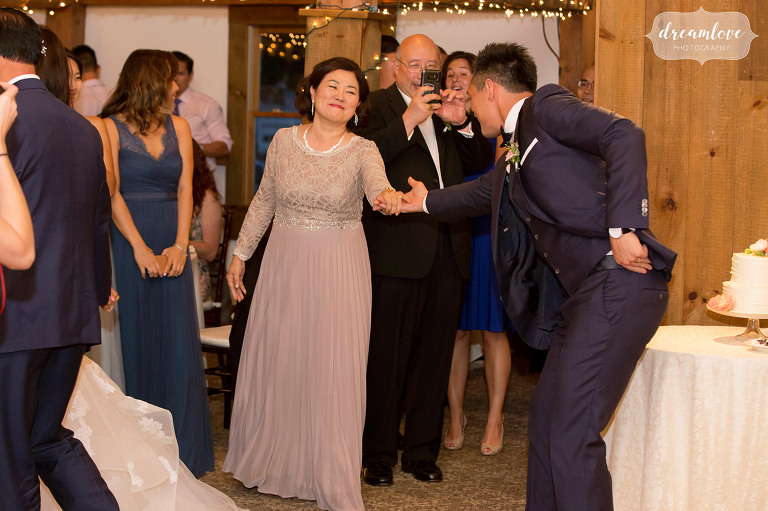 Sweet moment photo of the groom asking his mom to dance at this Wolfeboro, NH wedding reception.