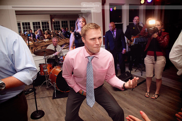 A guest plays the air guitar during a wedding reception at the Wychmere. 