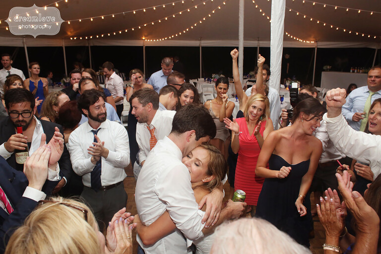 Bride and groom hugging in the middle of the dance floor on Cape Cod.