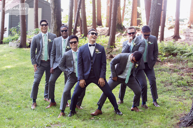 Funny photo of Korean groomsmen wearing sunglasses and acting silly outside under the trees in Wolfeboro, NH.