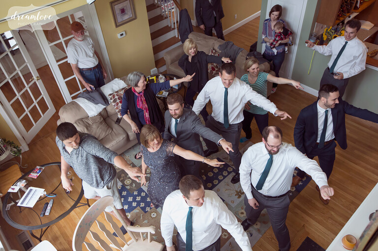 We love this candid and funny photo of the groom and his guys doing a choreographed dance before the ceremony.