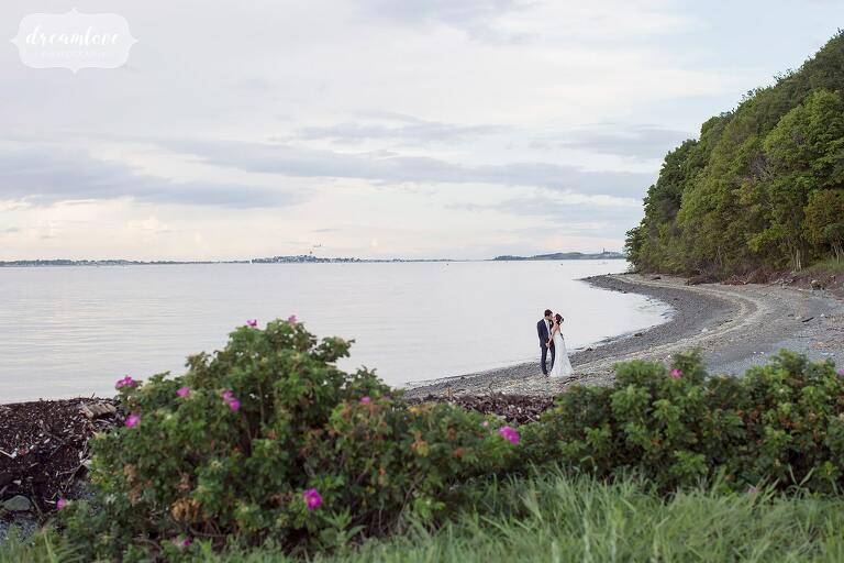 Fine art wedding photography of bride and groom on the beach on Thompson Island.