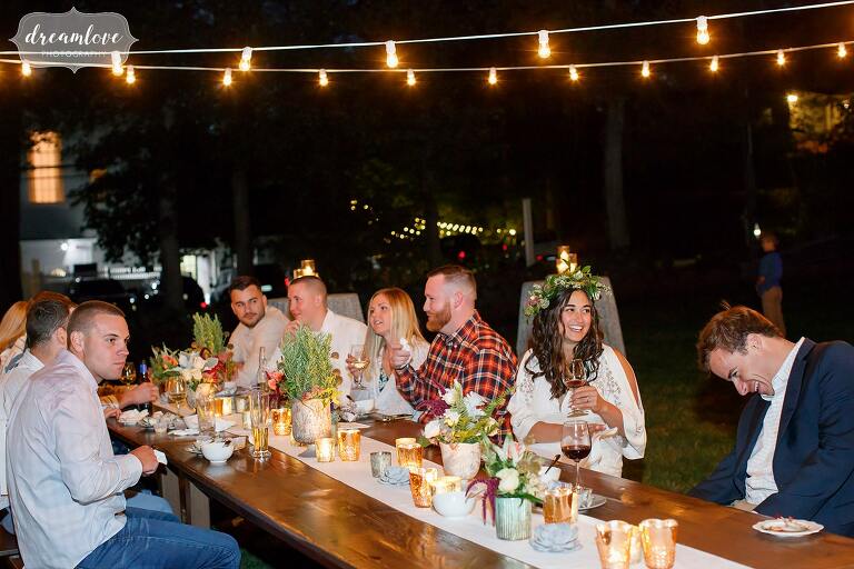 The bride to be enjoys her lobster dinner at this outdoor rehearsal at Gould Barn.