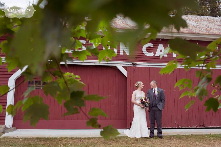 This barn wedding in the white mountains had a beautiful red barn where the bride and groom could pose at Bishop Farm.