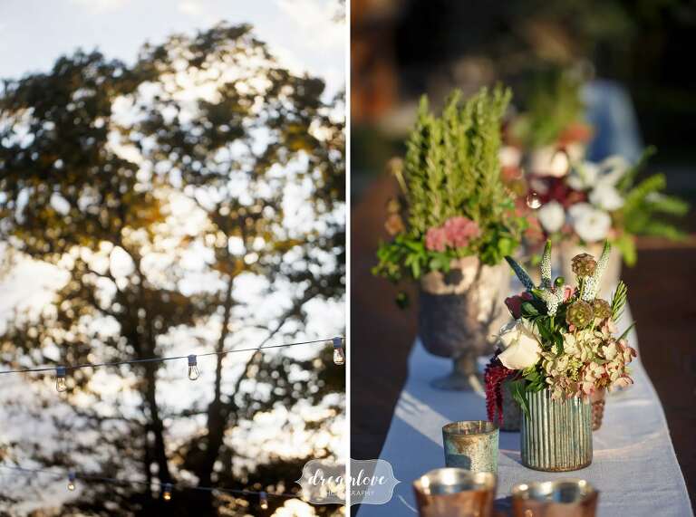 Earthy ceramic vases with herbs for this rustic rehearsal dinner table decor.