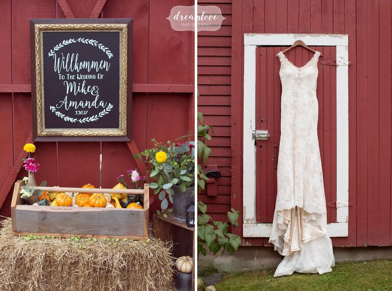 This rustic NH barn wedding venue at Bishop Farm is perfect for chalkboard signs and the wedding dress hanging on the red barn door.