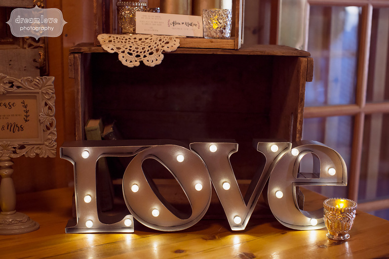 Marquis letters lit up spelling LOVE at this rustic wedding in CT.