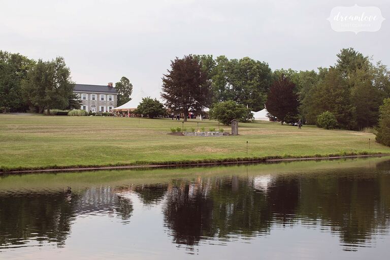 View of the One Barn Farm wedding venue with pond in Mifflingburg, PA.