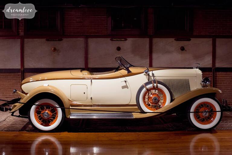 This antique roadster is an awesome backdrop at the unique venue, the Larz Anderson Auto Museum.