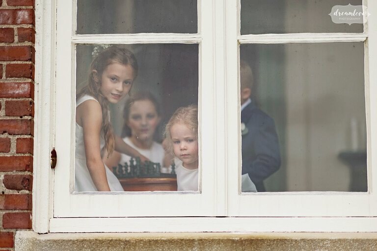 Kids looking out window at Misselwood wedding.