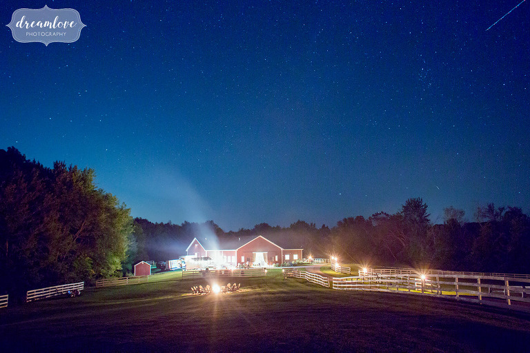 The Barn at Liberty Farms wedding venue with a starry blue sky at dusk in Ghent, NY.