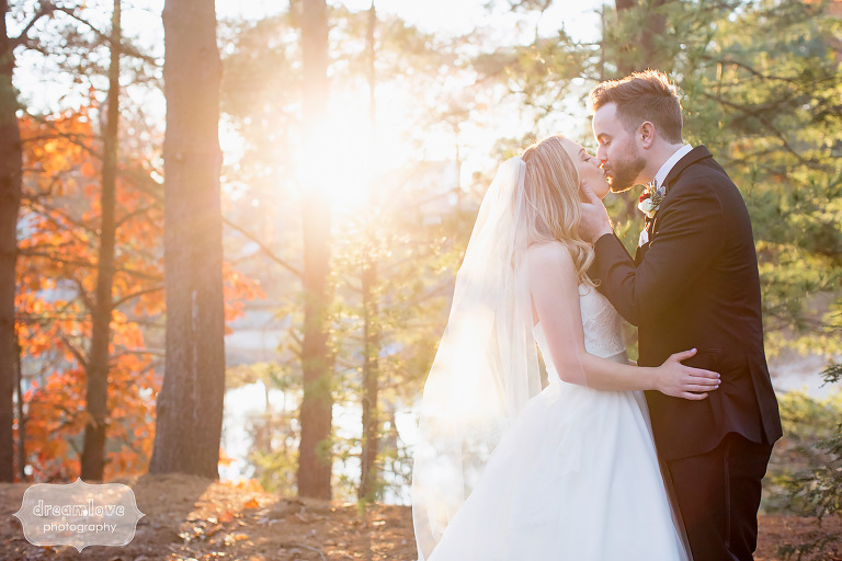 Sunbursty portrait of the bride and groom after their November wedding outside at the Crystal Lake Pavilion.