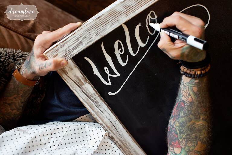 Artistic wedding sign with tattoos.