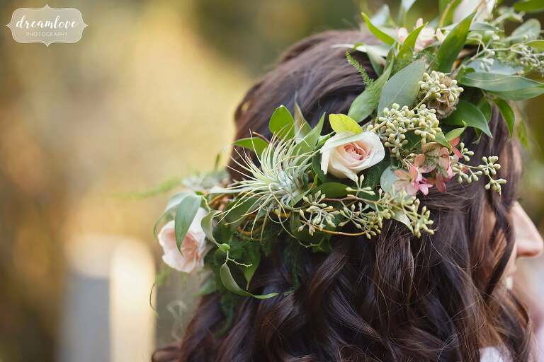 This romantic flower crown with air plants, eucalyptus and blush roses was fit for a fairytale at this rehearsal dinner.