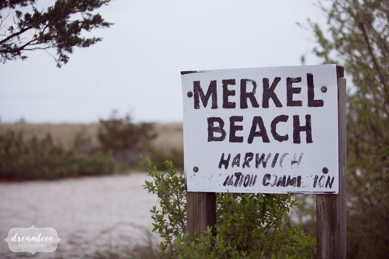 Merkel beach sign for bride and groom portraits after their Wychmere wedding.