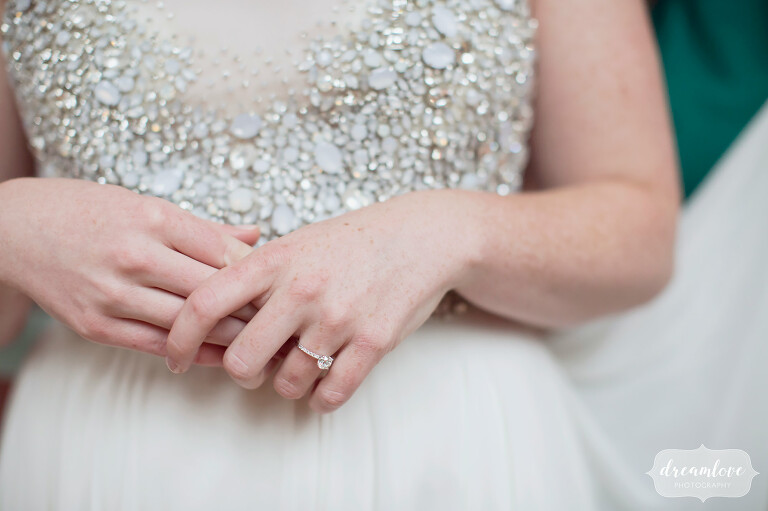 Simple wedding photography of the bride's hands on her sparkle dress at this Cape Cod spring wedding.