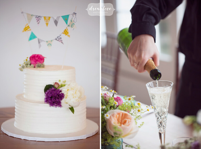 Modern and simple wedding cake with colorful pennants topper at the Wychmere.