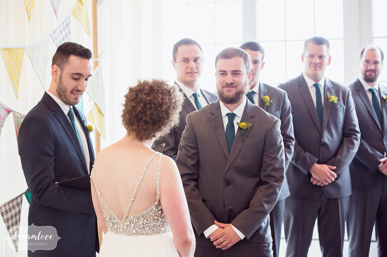 Bright and modern ceremony with the bride and groom at this Cape Cod wedding.