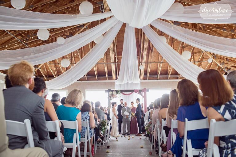 Romantic-indoor-ceremony-draped-fabric-boston