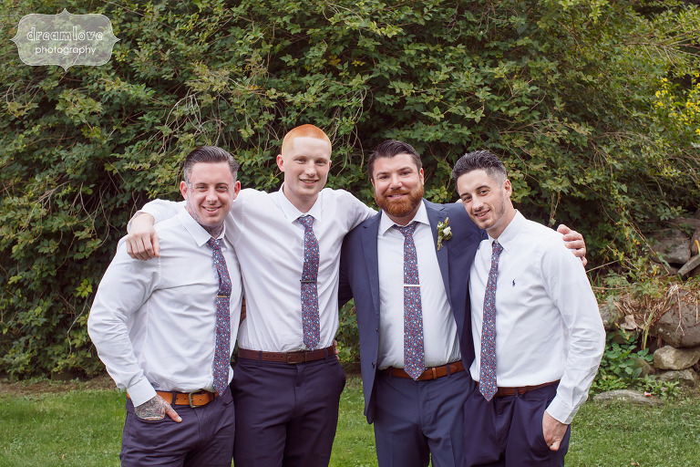 Groomsmen with their arms around each other for wedding in Quechee, VT.