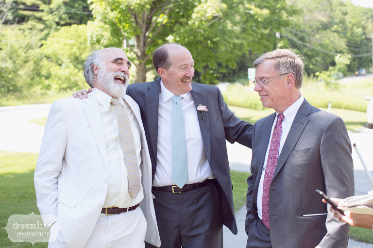 Great candid wedding photo of the father of the groom with friends at the Hildene in Manchester, VT.