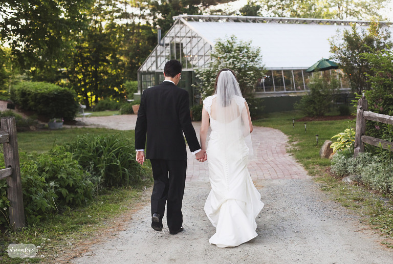 Couple holds hands at the Barn on the Pemi wedding venue in NH.