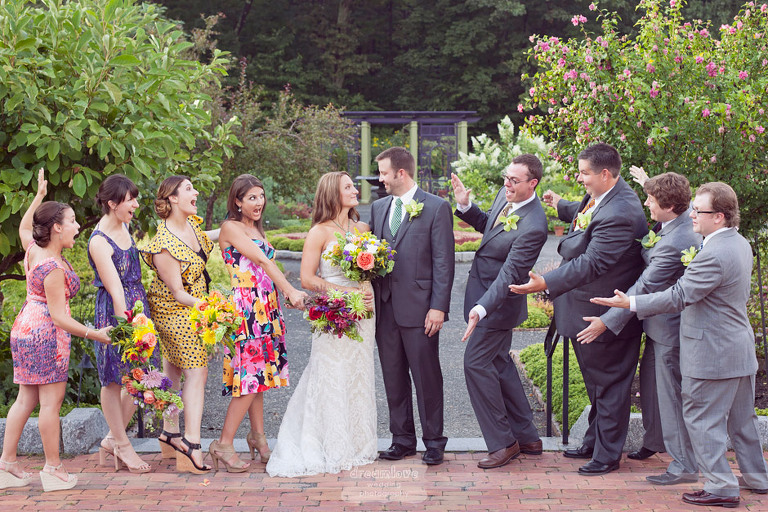 colorful wedding party dresses and flowers at this tower hill botanic garden wedding