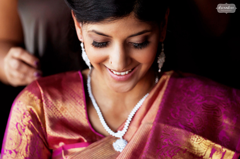 Beautiful indian woman prepares for wedding day at the Boston Library.