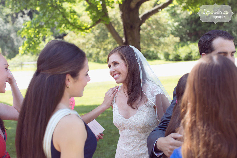 Candid photo of the bride with wedding guests at the Hildene in Manchester, VT.