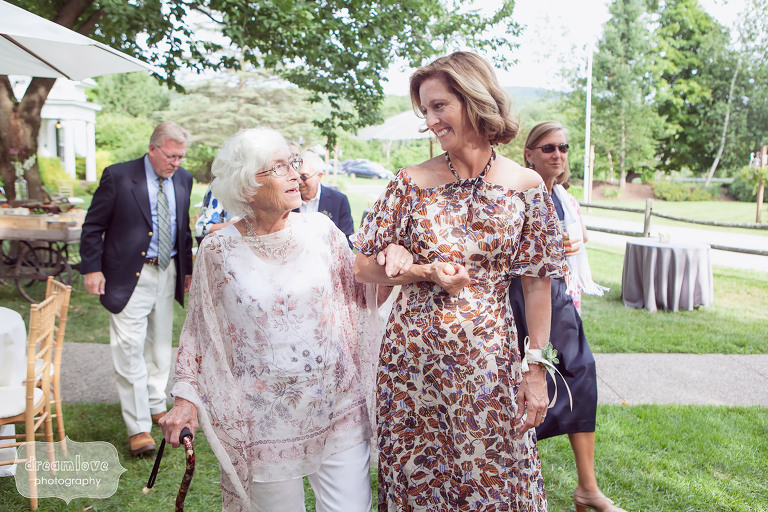 Candid wedding photo of the mother of the groom with grandma at this 1824 House wedding in VT.