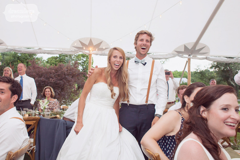 Candid photo of the bride and groom laughing during their reception at the 1824 House in VT.