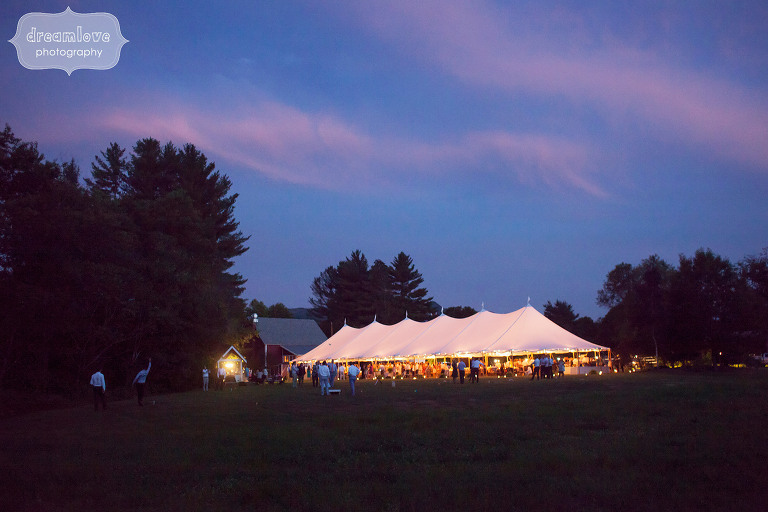 Magical wedding photo of the reception tent lit up at night under the stars at the 1824 House in VT.
