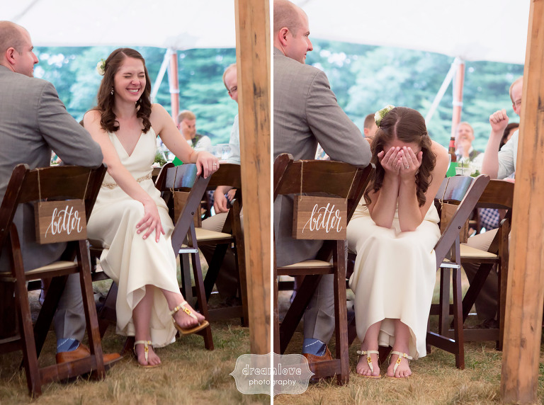 Documentary photos of the bride laughing during wedding speeches at the Woodbound Inn in NH.
