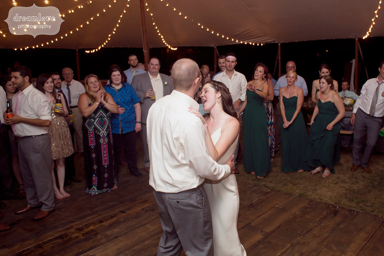 Bride and groom dancing at the end of their tented reception at the Woodbound Inn, NH.