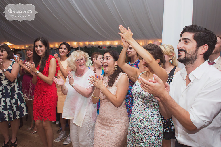 Documentary photos of wedding guests on the dance floor in Stowe, VT.