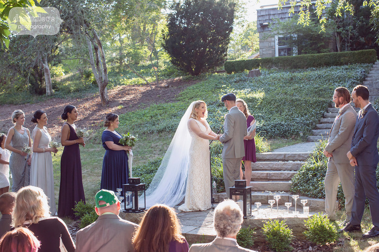 Romantic outdoor wedding ceremony at the Overbrook House under the trees on Cape Cod, MA.